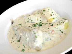 Monkfish with mushroom sauce and extra virgin olive oil