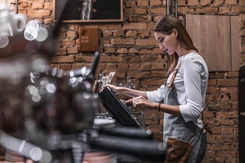 young-woman-at-counter-with-cashbox-working-in-cof-2022-05-31-02-23-26-utc (1)